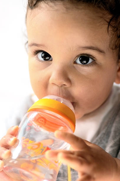 istock Baby Child drinking milk bottle ( serie) 157402291