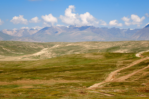 Dirt road & blue sky of north Mongolian steppe