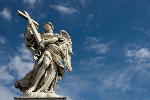 Bernini angel on Ponte San Angelo with cross.