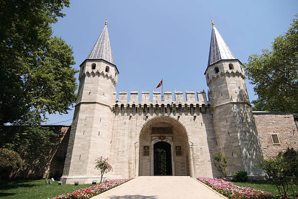 Gate of Salutation (Topkapi Palace) The large Gate of Salutation, leads into the palace and the Second Courtyard. This crenulated gate has two large octagonal pointed towers. No one apart for official purpose and foreign dignitaries were allowed passage through the gate.  topkapi palace stock pictures, royalty-free photos & images