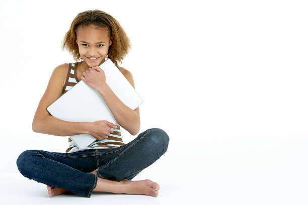 Teenage Girl Hugging Laptop stock photo