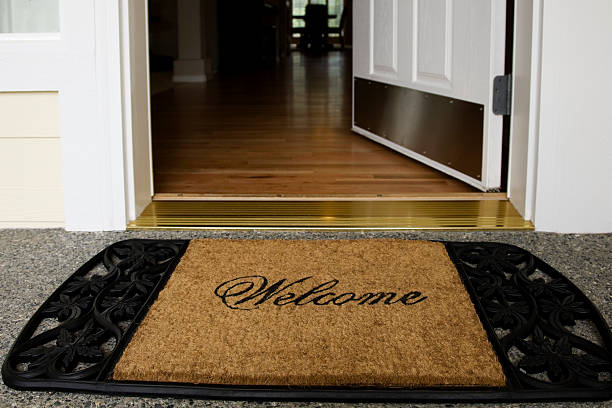 Welcome mat entrance new home door wood floor clean inviting  doorstep stock pictures, royalty-free photos & images