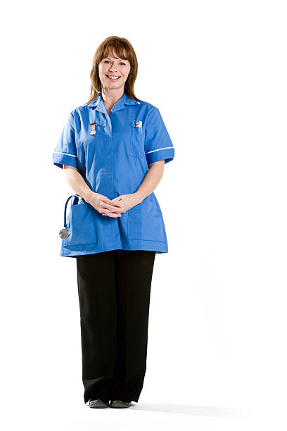 atención médica: asistente de atención - nurse midwife full length nhs fotografías e imágenes de stock