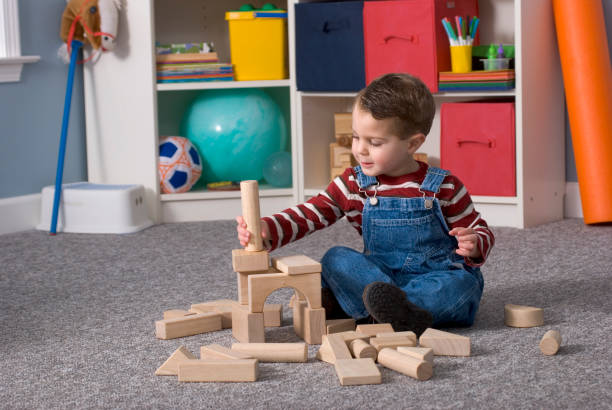 istock Boy Building With / Looking At Wooden Toy Blocks, Horizontal 157402809