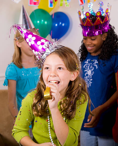 Happy young girls at a birthday party.