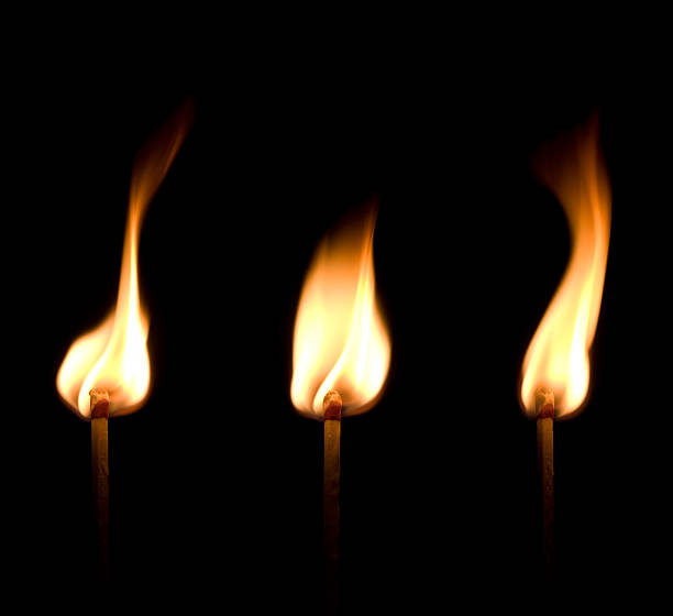 flaming corrispondono trio - arson black bright burning foto e immagini stock