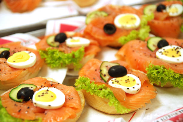 A smoked salmon roulade with a sprig of dill. A delicious spiral of fresh smoked salmon, mascarpone, capers, garlic, grated lemon rind and dill all rolled up in a delicious savory pancake