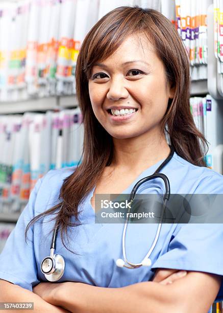 Friendly Medical Assistant Stock Photo - Download Image Now - 30-34 Years, 30-39 Years, Adult