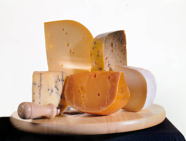 istock cheeses on a wooden plate 157403281