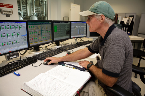 Dispatcher background. The workplace of the traffic manager at the airport at the tower. Chair, table, monitors, screens and equipment. Air traffic controller work