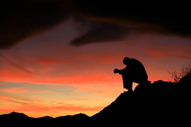 istock Silhouette of a Man Meditating 157403500