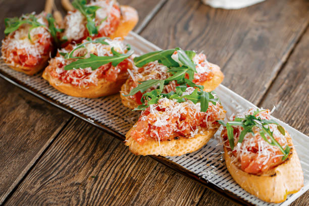 istock Portion of gourmet bruschettas appetizer 1574036356