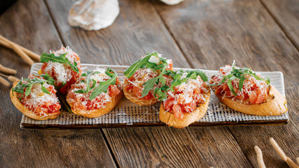 istock Portion of gourmet bruschettas appetizer 1574036360