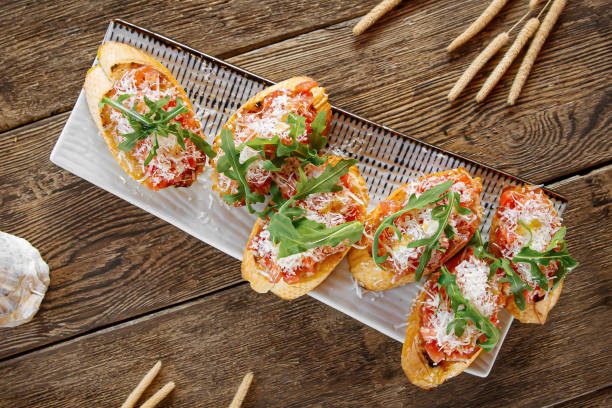 istock Portion of gourmet bruschettas appetizer 1574037455