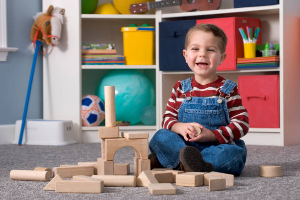 istock Laughing Boy Building With Wooden Toy Blocks, Horizontal 157403953