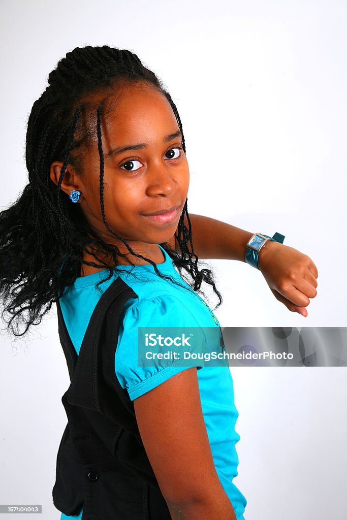 African American Girl Checking Time  12-13 Years Stock Photo