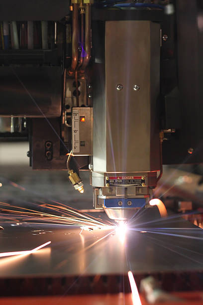 High speed cnc laser cutter at work. stock photo