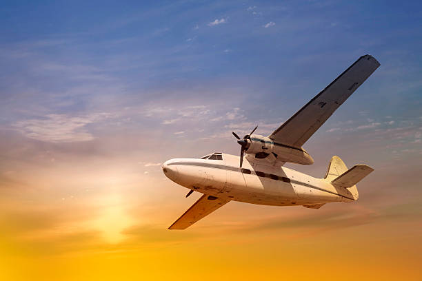 Antique propeller airplane at sunset  propeller airplane stock pictures, royalty-free photos & images
