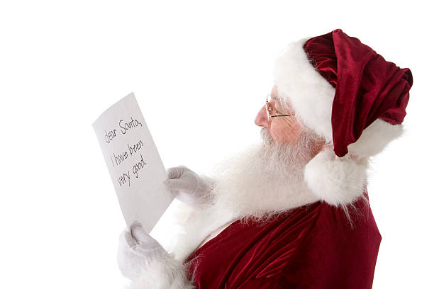 istock Real Santa Claus Reading Letter from Child 157404143