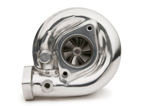 A polished turbocharger isolated on white.  Clipping Path on object.