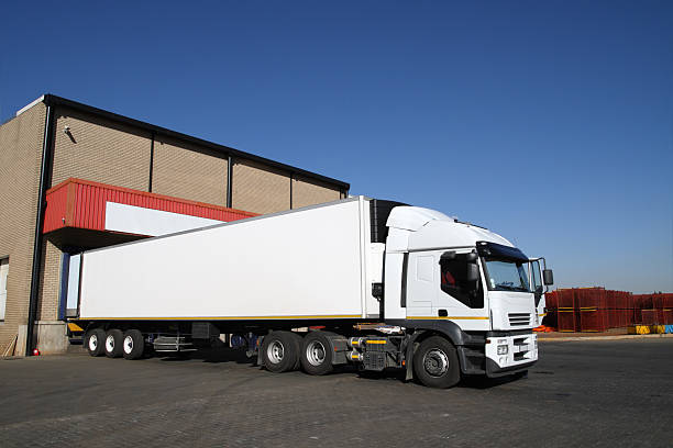istock Refrigerated semi truck at a cold storage warehouse loading bay. 157404204