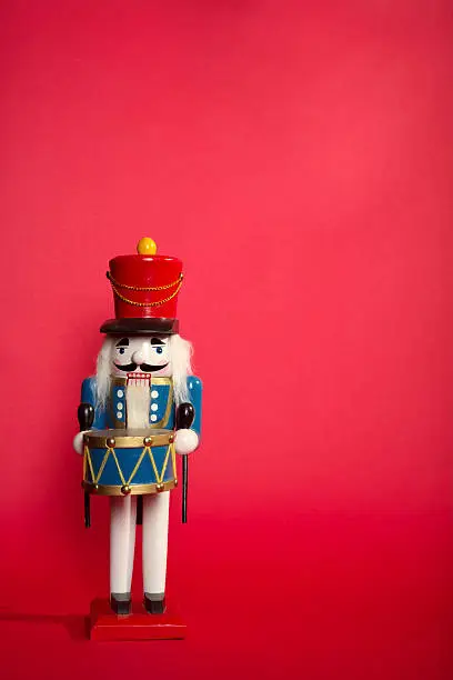 Nutcracker Toy Soldier on red background.....To See more HOLIDAY IMAGES Please click this Image :