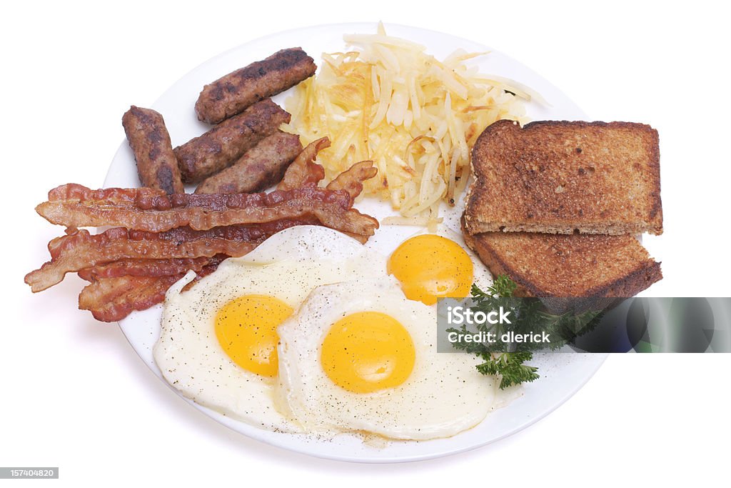 Breakfast plate with egg, sausage, bacon and toast.  Bacon Stock Photo