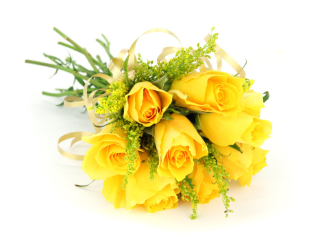 Yellow rose bouquet isolated on white with ribbon