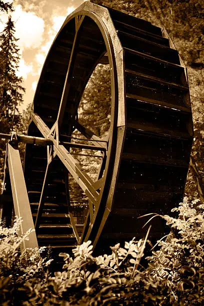 Sepia toned water wheel - water droplets frozen in mid-air (British Columbia, Canada)