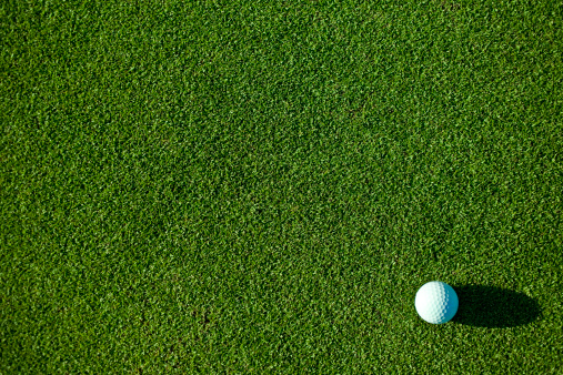 Golf Ball on putting green.