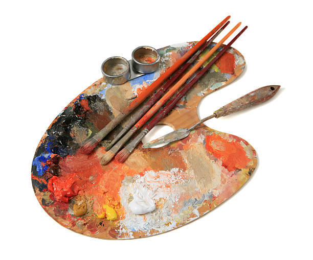 Wooden palette with paintbrushes and oil paint on white oil paint palette stock pictures, royalty-free photos & images