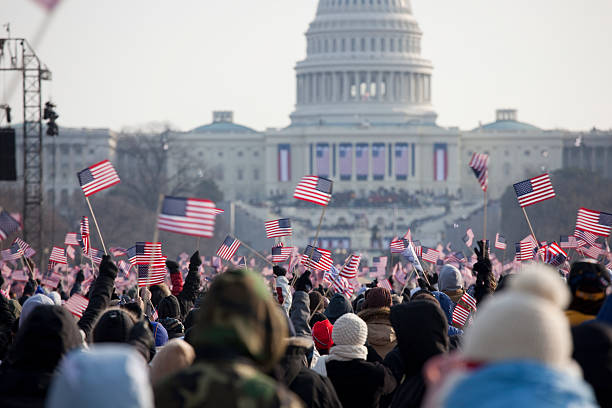 Barack Obama's Presidential Inauguration at Capitol Building, Washington DC The inauguration of President Barack Obama, January 20th 2009.  Unrecognizable crowds in the Washington Mall.     2009 stock pictures, royalty-free photos & images