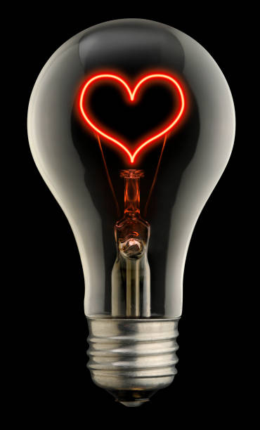 a luz do amor - lighting equipment illuminated isolated on black part of - fotografias e filmes do acervo