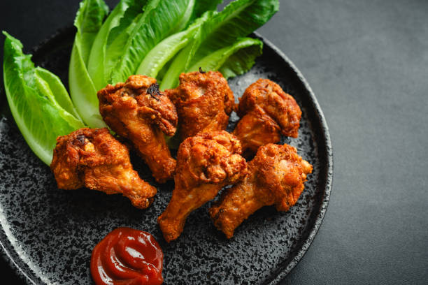 istock Crispy Chicken Drumstick with Tomato Sauce 1574101946