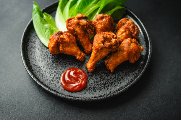 istock Crispy Chicken Drumstick with Tomato Sauce 1574102356