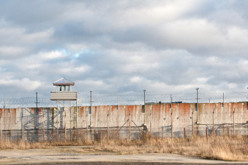 Panoramic view of prison wall and guard lookout tower.
