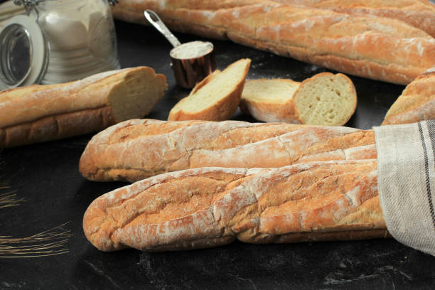 Fresh French Baguettes on Dark Background.