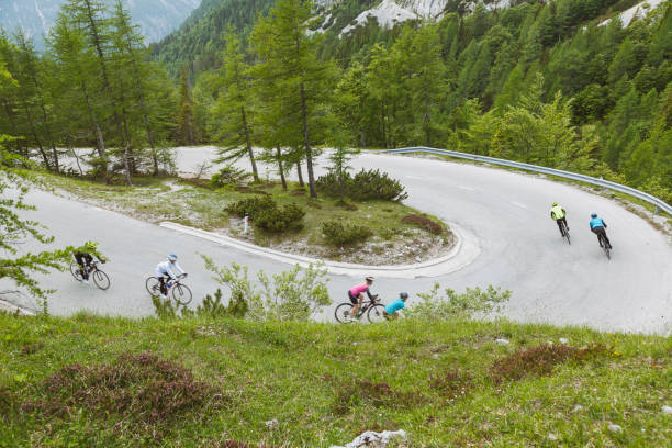 istock Group of cyclists on a hairpin curve 1574156417