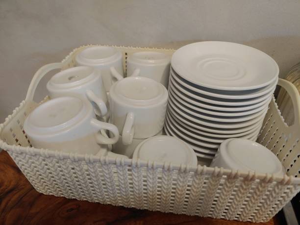 istock porcelain Coffee set in a white wicker 1574166443