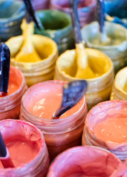 istock Large group of open cans of multi-coloured paints 1574175215