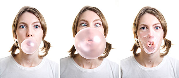 Girl Blowing Bubble Gum which Pops on Her Face A sequence of photos showing a young woman who blows a large bubble only to have it pop in a messy explosion all over her face.  Isolated on a white background. bubble gum photos stock pictures, royalty-free photos & images