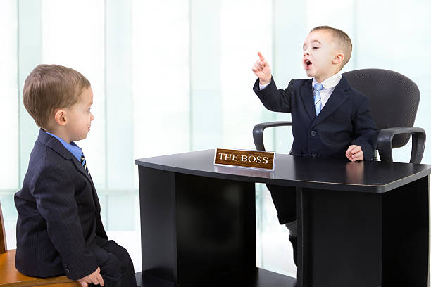 Scolded by the boss An employee getting yelled at by the boss. bossy stock pictures, royalty-free photos & images