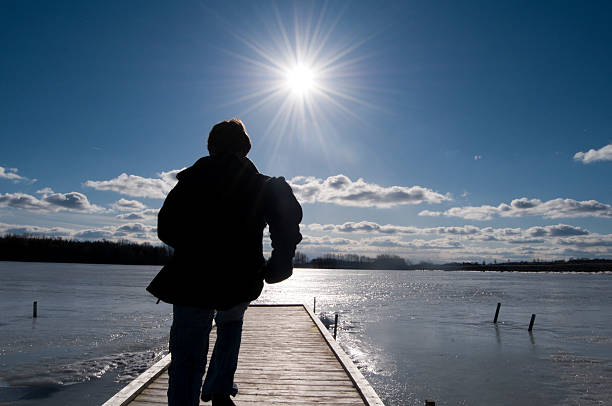 istock Boy Running Toward the Sun 157418595