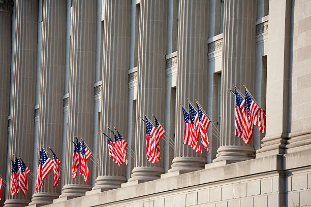 US flag decorations between columns for Obama's swearing in Flags are posted and waving for Barack Obama's presidential Inauguration.  Washington DC.  Check out my  inauguration into office photos stock pictures, royalty-free photos & images