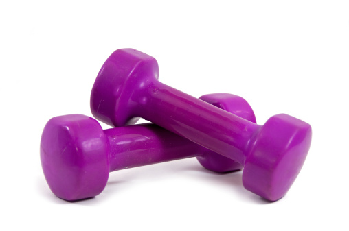 A pair of five pond esercise weights on a white background... copy space.