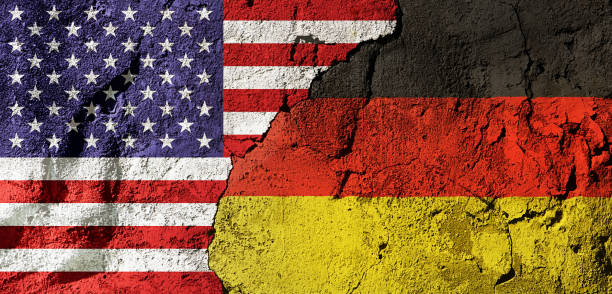 istock Flags of America and Germany overlapping on a distressed concrete wall 1574189668