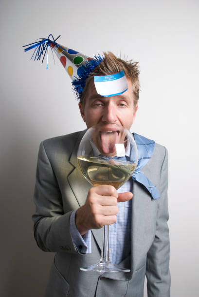 istock Drunk Businessman Office Worker Drinking with Name Tag 157418990
