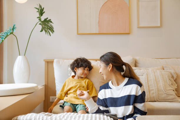 istock Single mother spending time with her son while staying at home. 1574190804