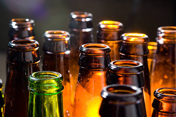 Beer Bottles Beer Bottles lined up beer bottle stock pictures, royalty-free photos & images