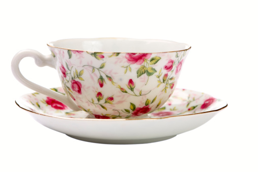 Antique china tea cup isolated on white.
